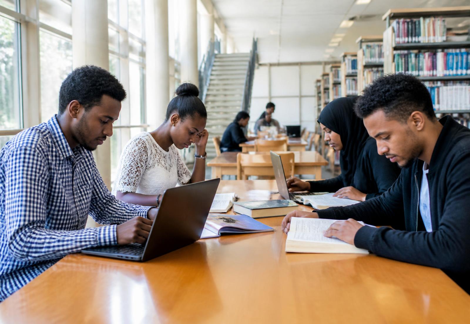 University students studying together in a library
